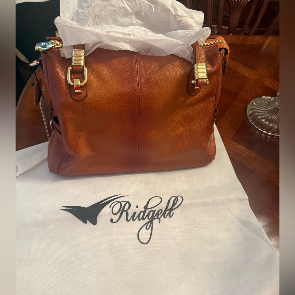New Family Branded Bags100%genuine Italian leather
The Ridgell Handbags Tan